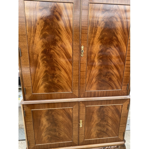 2592 - A MAHOGANY FOUR DOOR COCKTAIL CABINET WITH PULL-OUT SLIDE, ON CABRIOLE LEGS, 33.5