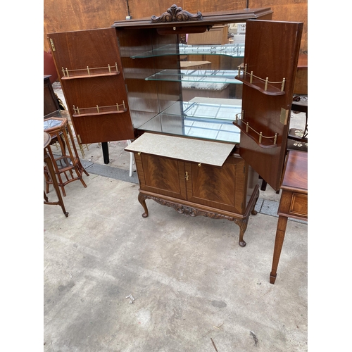 2592 - A MAHOGANY FOUR DOOR COCKTAIL CABINET WITH PULL-OUT SLIDE, ON CABRIOLE LEGS, 33.5