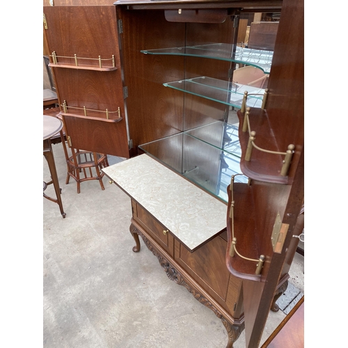 2592 - A MAHOGANY FOUR DOOR COCKTAIL CABINET WITH PULL-OUT SLIDE, ON CABRIOLE LEGS, 33.5