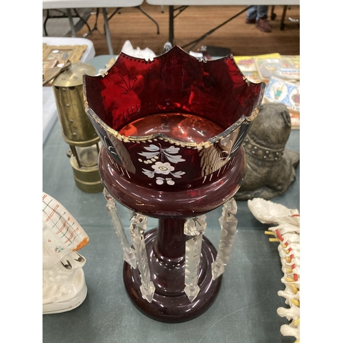 144 - A LARGE CRANBERRY GLASS CANDLE HOLDER WITH HANDPAINTED DECORATION AND CRYSTAL DROPLETS, HEIGHT 31CM