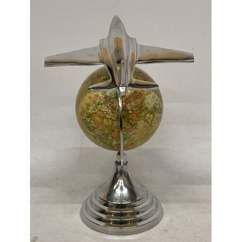 27 - A DESK GLOBE WITH CHROME EFFECT BASE AND AEROPLANE DESIGN