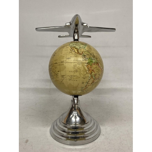 27 - A DESK GLOBE WITH CHROME EFFECT BASE AND AEROPLANE DESIGN