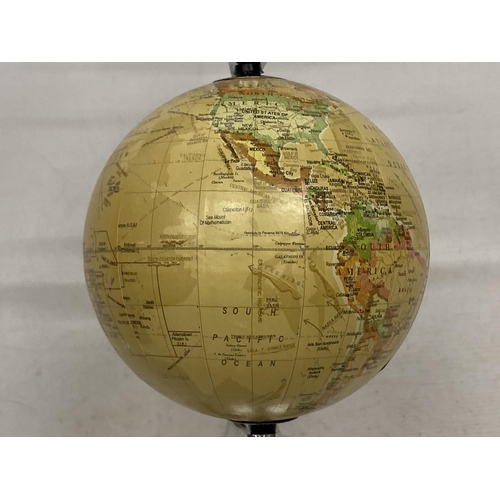 27 - A DESK GLOBE WITH CHROME EFFECT BASE AND AEROPLANE DESIGN