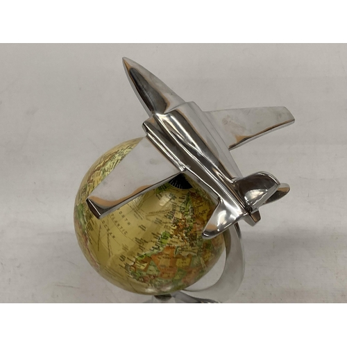 27 - A DESK GLOBE WITH CHROME EFFECT BASE AND AEROPLANE DESIGN