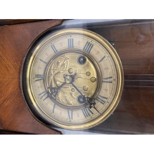 30 - A MAHOGANY CASED VIENNA WALL CLOCK WITH EAGLE DESIGN TOP, WITH PENDULUM AND KEY