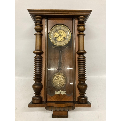 30 - A MAHOGANY CASED VIENNA WALL CLOCK WITH EAGLE DESIGN TOP, WITH PENDULUM AND KEY