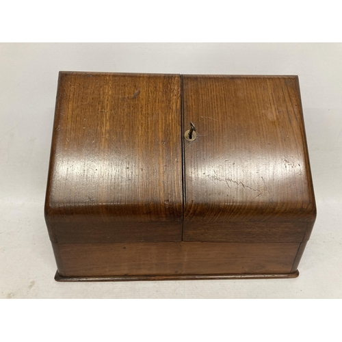 31 - A VINTAGE MAHOGANY TWIN DOOR DESK LETTER BOX WITH TWO GLASS INKWELLS, WITH KEY