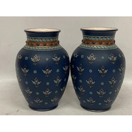 43 - A PAIR OF METTLACH FLORAL DESIGN VASES, STAMPED 1875 TO BASE