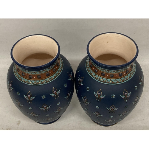 43 - A PAIR OF METTLACH FLORAL DESIGN VASES, STAMPED 1875 TO BASE