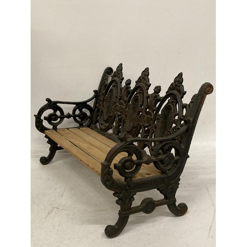 46 - A TABLE TOP CAST VICTORIAN STYLE BENCH WITH WOODEN SLATTED SEAT