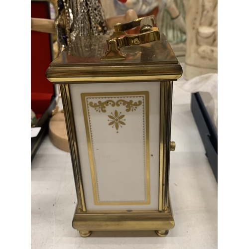 160 - A CERAMIC SPODE CLOCK IN A BRASS CASE