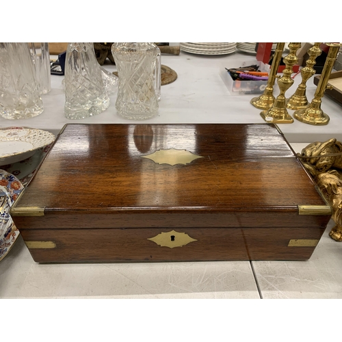 166 - A VINTAGE MAHOGANY WRITING SLOPE WITH ONE INKWELL AND KEY