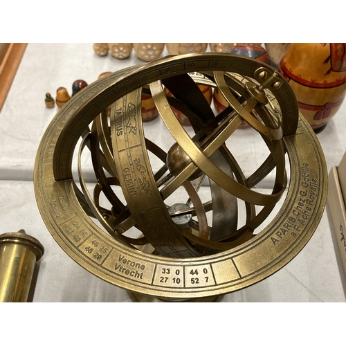 220 - A BRASS REVOLVING GLOBE STYLE DESK COMPASS WITH BIRTH SIGNS