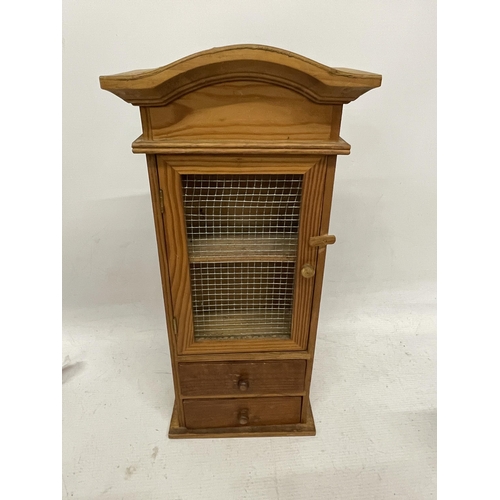 140A - AN APPRENTICE PIECE CABINET WITH TWO DRAWERS AND A MESH FRONTED DOOR