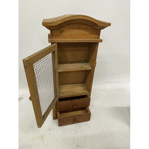 140A - AN APPRENTICE PIECE CABINET WITH TWO DRAWERS AND A MESH FRONTED DOOR