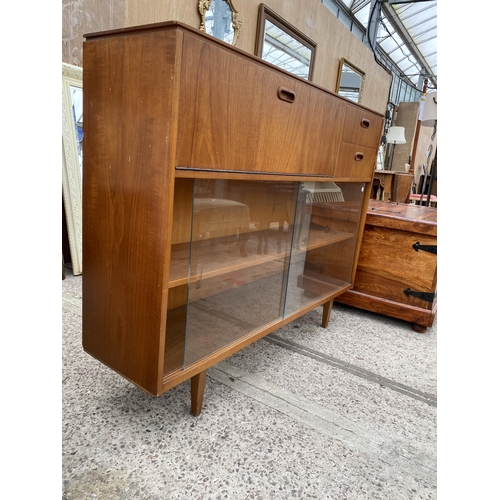 3086 - A RETRO TEAK BOOKCASE WITH TWO SLIDING GLASS DOORS, TWO DRAWERS AND BUREAU SECTION, 44.5