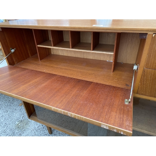 3086 - A RETRO TEAK BOOKCASE WITH TWO SLIDING GLASS DOORS, TWO DRAWERS AND BUREAU SECTION, 44.5