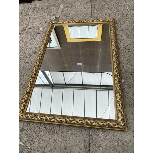 3090 - A GILT FRAMED WALL MIRROR, 47 X 31