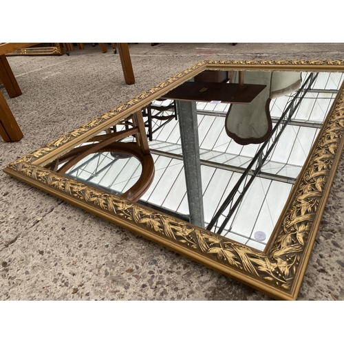 3090 - A GILT FRAMED WALL MIRROR, 47 X 31