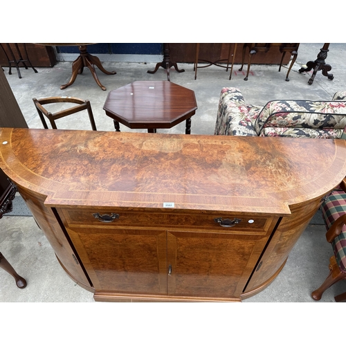 2582 - A REPRODUCTION WALNUT AND CROSSBANDED BREAKFRONT SIDEBOARD WITH FOUR CUPBOARDS AND THREE DRAWERS, 66... 