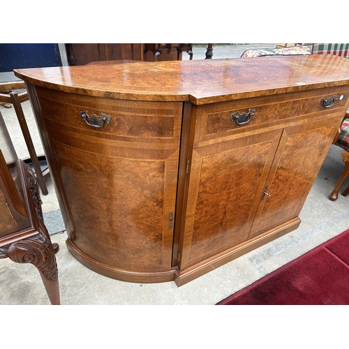 2582 - A REPRODUCTION WALNUT AND CROSSBANDED BREAKFRONT SIDEBOARD WITH FOUR CUPBOARDS AND THREE DRAWERS, 66... 