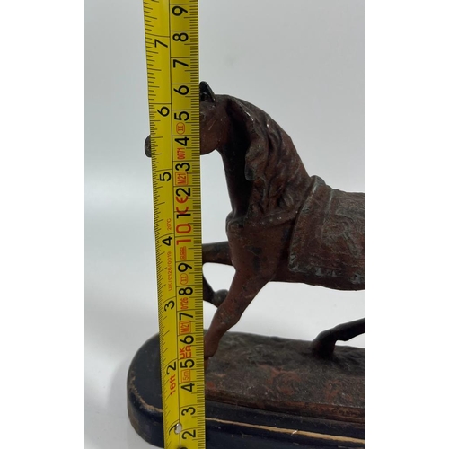 54 - A VINTAGE CAST IRON OR SPELTER MODEL OF A HORSE ON A WOODEN BASE, HEIGHT 16CM