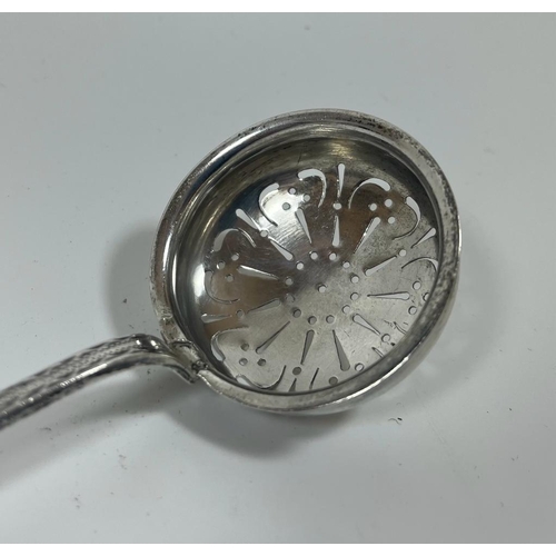 56 - A .99 STAMPED SILVER ANTIQUE SUGAR SIFTER, LENGTH 18.5 CM