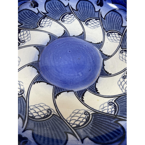 703 - A LARGE ART NOUVEAU ROYAL DOULTON BLUE AND WHITE GEOMETRIC FRUIT BOWL WITH ARTISTS MONOGRAM TO BASE