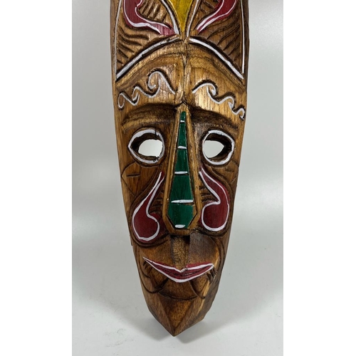 107 - A LARGE VINTAGE AFRICAN PAINTED WOODEN TRIBAL MASK, LENGTH 49 CM