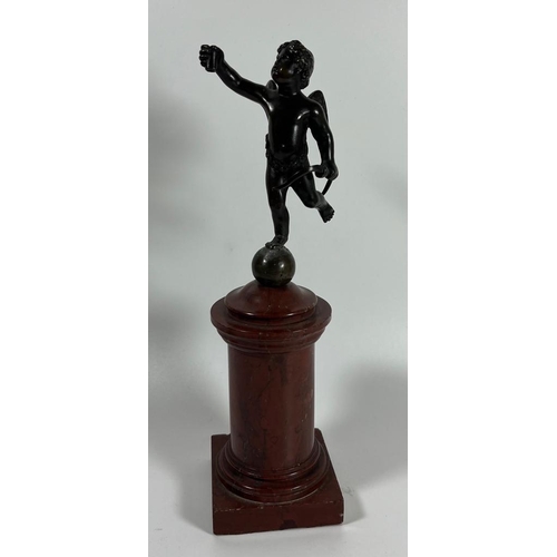 52 - A FRENCH BRONZE MODEL OF CUPID ON A RED MARBLE BASE, HEIGHT 23 CM