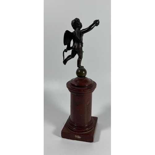 52 - A FRENCH BRONZE MODEL OF CUPID ON A RED MARBLE BASE, HEIGHT 23 CM