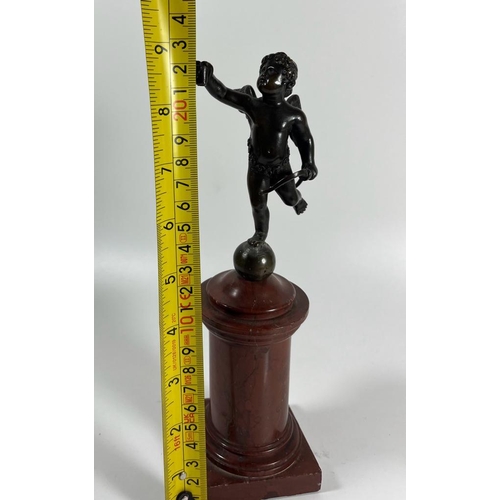 52 - A FRENCH BRONZE MODEL OF CUPID ON A RED MARBLE BASE, HEIGHT 23 CM