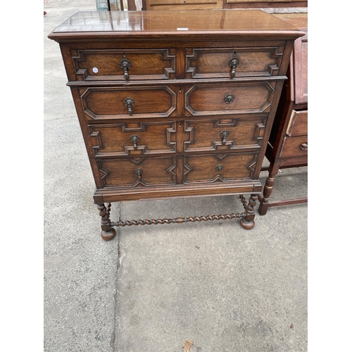 AN EARLY 20TH CENTURY OAK JACOBEAN STYLE CHEST OF TWO SHORT AND THREE ...