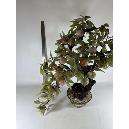 15 - A LARGE AND IMPRESSIVE ORIENTAL MODEL OF A BONSAI TREE WITH GREEN GLASS LEAVES AND PINK FRUIT DESIGN... 