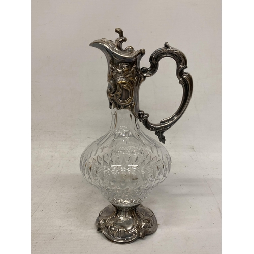 3 - AN ORNATE SILVER PLATED AND CUT GLASS CLARET JUG