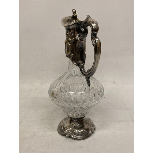 3 - AN ORNATE SILVER PLATED AND CUT GLASS CLARET JUG