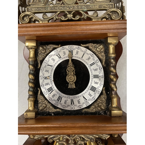 34 - A SWISS WALL CLOCK WITH BRASS WEIGHTS
