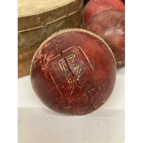 9 - A COLLECTION OF VINTAGE SPORTING ITEMS, SPALDING RUGBY BALL, CRICKET BALLS AND A TAMBORINE
