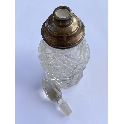 70 - A SILVER AND CUT GLASS PERFUME BOTTLE, HEIGHT 18 CM