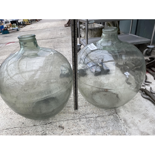 1634 - A PAIR OF LARGE VINTAGE GLASS CARBOYS