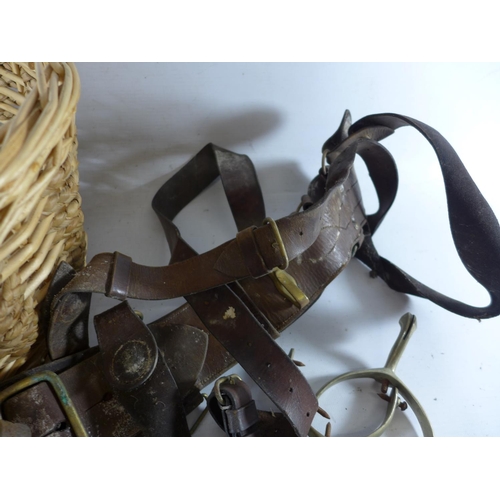 377 - A BASKET CONTAINING A LEATHER SAM BROWNE, SWORD HOLDER, STIRRUPS ETC