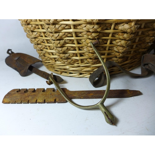 377 - A BASKET CONTAINING A LEATHER SAM BROWNE, SWORD HOLDER, STIRRUPS ETC