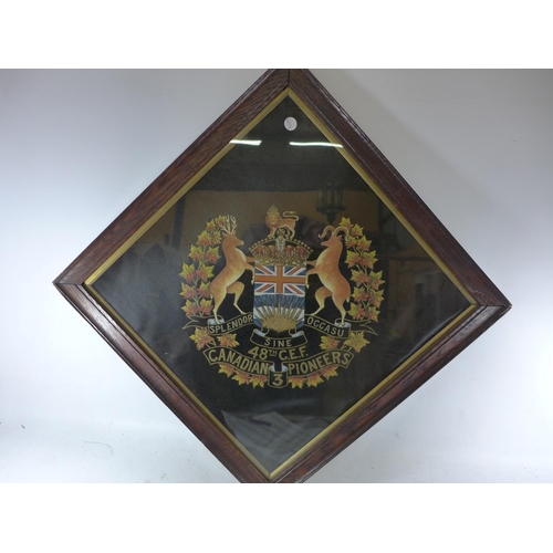 379 - A FRAMED PAINTED 48TH C.E.F. CANADIAN 3RD PIONEERS BADGE, 61 X 63CM, MEDICAL CORPS EMBROIDERED BADGE... 