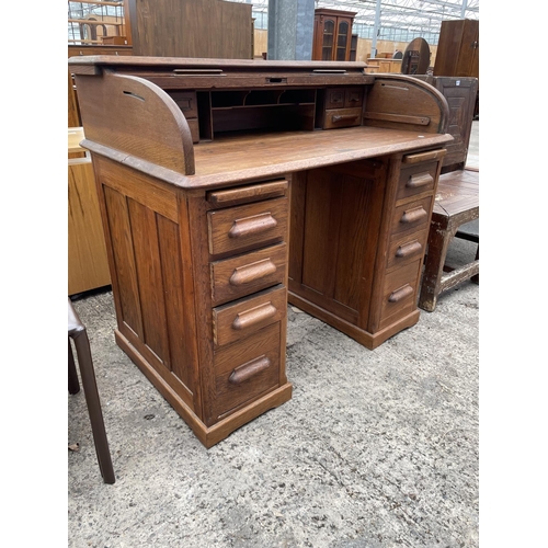 3059 - AN EARLY 20TH CENTURY OAK ROLL-TOP DESK ENCLOSING EIGHT DRAWERS AND TWO SLIDES, 42