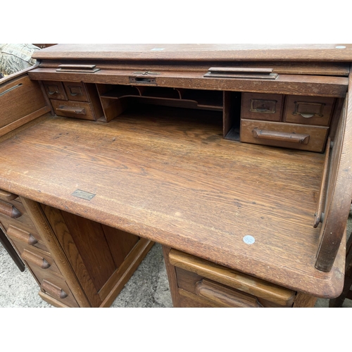 3059 - AN EARLY 20TH CENTURY OAK ROLL-TOP DESK ENCLOSING EIGHT DRAWERS AND TWO SLIDES, 42