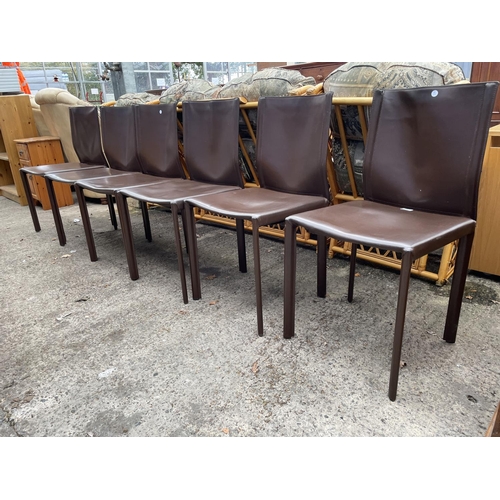 3060 - A SET OF SIX BROWN FAUX LEATHER DINING CHAIRS