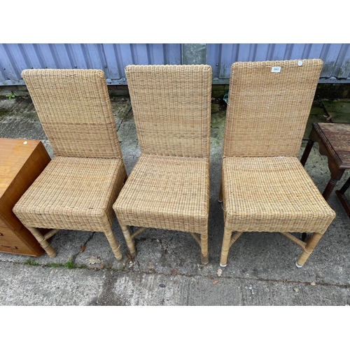 3063 - THREE WICKER HIGH BACK DINING CHAIRS