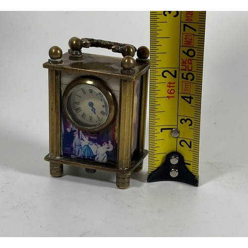 76 - A MINIATURE BRASS WIND UP CARRIAGE CLOCK WITH CLASSICAL AND NUDE FIGURAL PANELS, HEIGHT 6CM