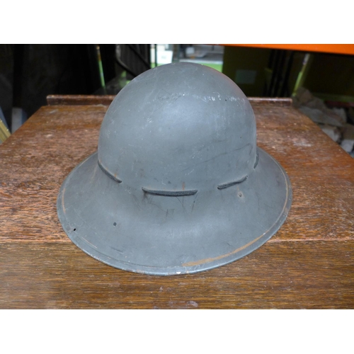 398 - A BRITISH WORLD WAR II HOME FRONT CIVIL DEFENCE PAINTED STEEL HELMET AND LINER DATED 1941