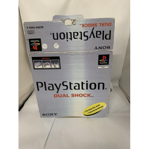 333 - A BOXED PLAYSTATION ONE TOGETHER WITH DUAL SHOCK CONTROLLER